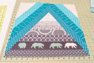 This Bear Mountain quilt-as-you-go (QAYG) block is a fun quilt block perfect for a mountain nursery or any woodland decor!