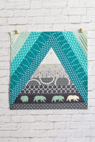 This Bear Mountain quilt-as-you-go (QAYG) block is a fun quilt block perfect for a mountain nursery or any woodland decor!
