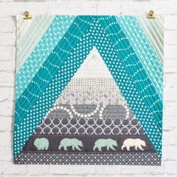 This Bear Mountain quilt-as-you-go (QAYG) block is a fun quilt block perfect for a mountain nursery or any woodland decor!