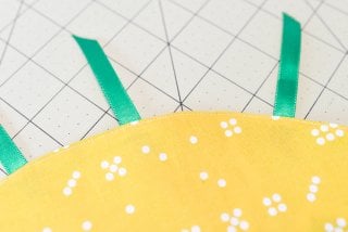 Make this adorable little pineapple purse for your kid who wants to carry around their little treasures! Sewn from a flat circle, cinched together with twine.