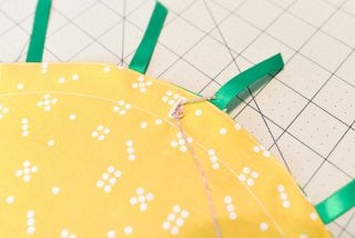 Make this adorable little pineapple purse for your kid who wants to carry around their little treasures! Sewn from a flat circle, cinched together with twine.