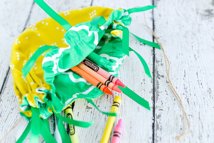 DIY cinched pineapple purse with crayons inside