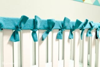 Baby chewing on the rails of his or her crib? Make these easy, no-sew fleece crib rail covers to protect the crib and your baby's teeth!