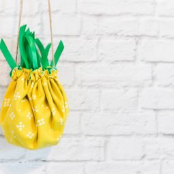 Make this adorable little pineapple purse for your kid who wants to carry around their little treasures! Sewn from a flat circle, cinched together with twine.