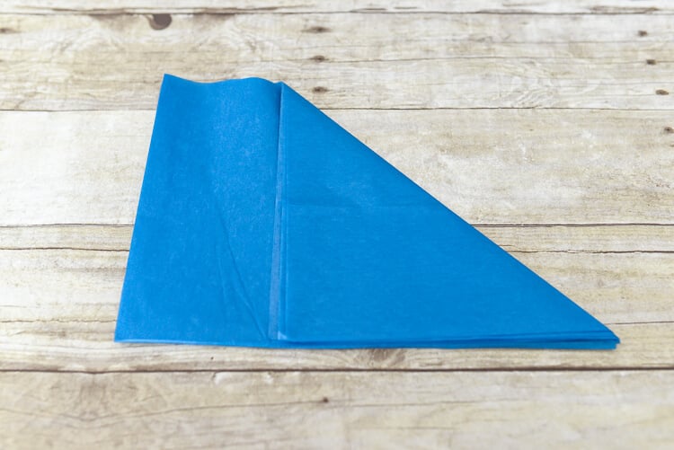 make tissue paper fireworks - fold the corner piece to the edge to create a triangle