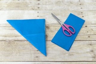 Red, white, and blue tissue paper explode in brilliant fireworks, perfect as easy Fourth of July party decor!