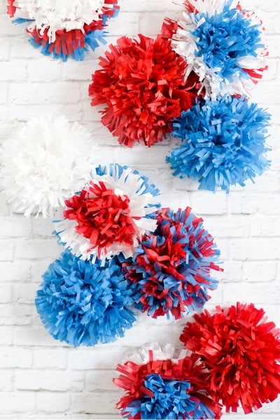 Red, white, and blue tissue paper explode in brilliant fireworks, perfect as easy Fourth of July party decor!