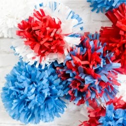 Red, white, and blue tissue paper explode in brilliant fireworks, perfect as easy Fourth of July party decor!