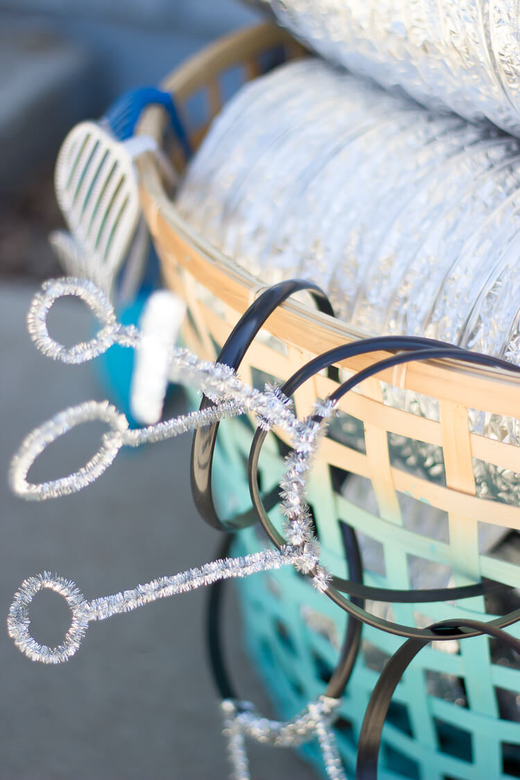 A basket with robot headbands hanging from it