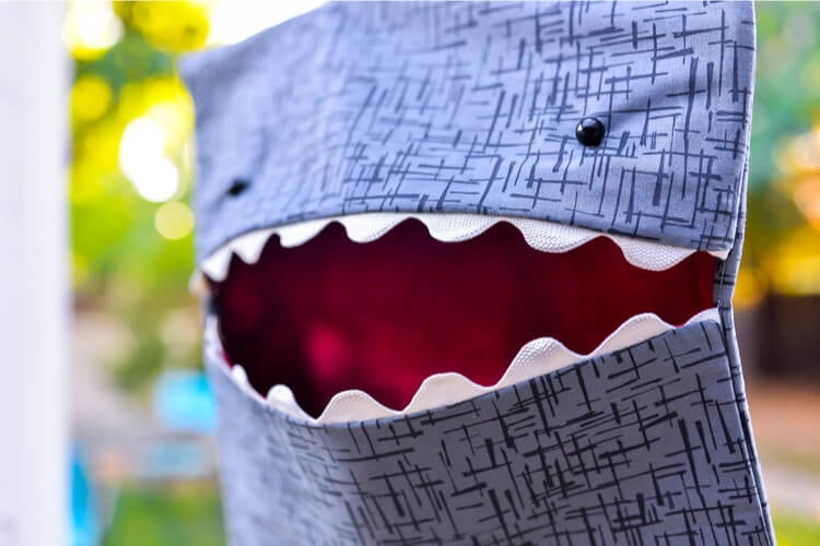 Close up of a shark clothespin bag