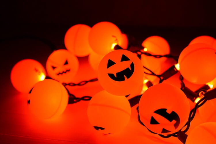 Orange ping pong balls plus fairy lights equal a fun Halloween Jack O' Lantern decoration! 