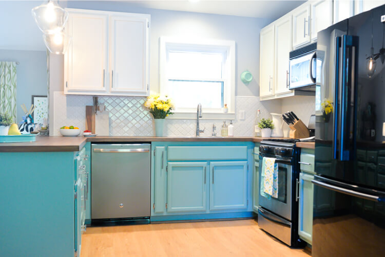 A kitchen with stainless steel appliances and wooden cabinets