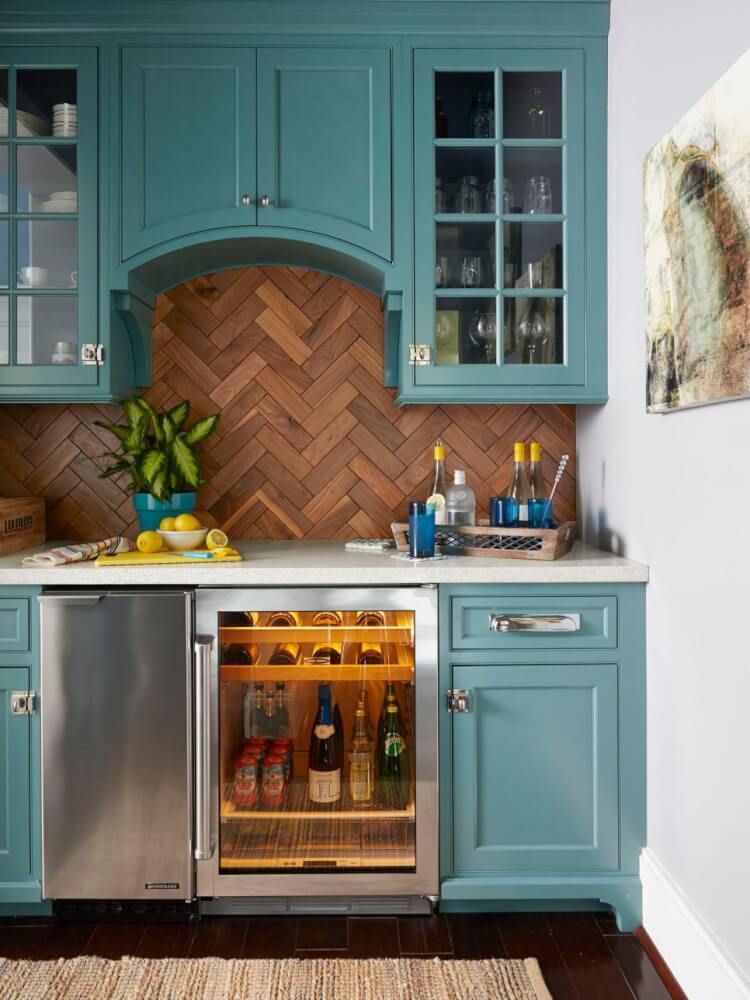 A bar in a kitchen with a mini fridge and a wine cooler