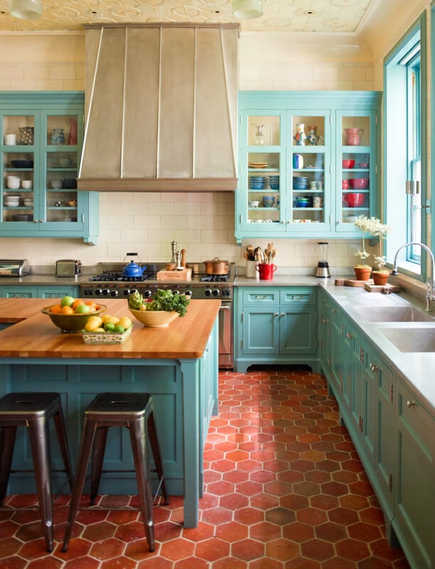 A kitchen with an island in the middle of a room