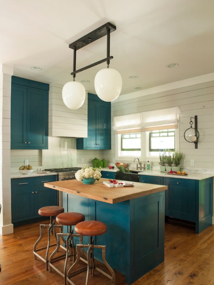 A kitchen with an island in the middle of a room