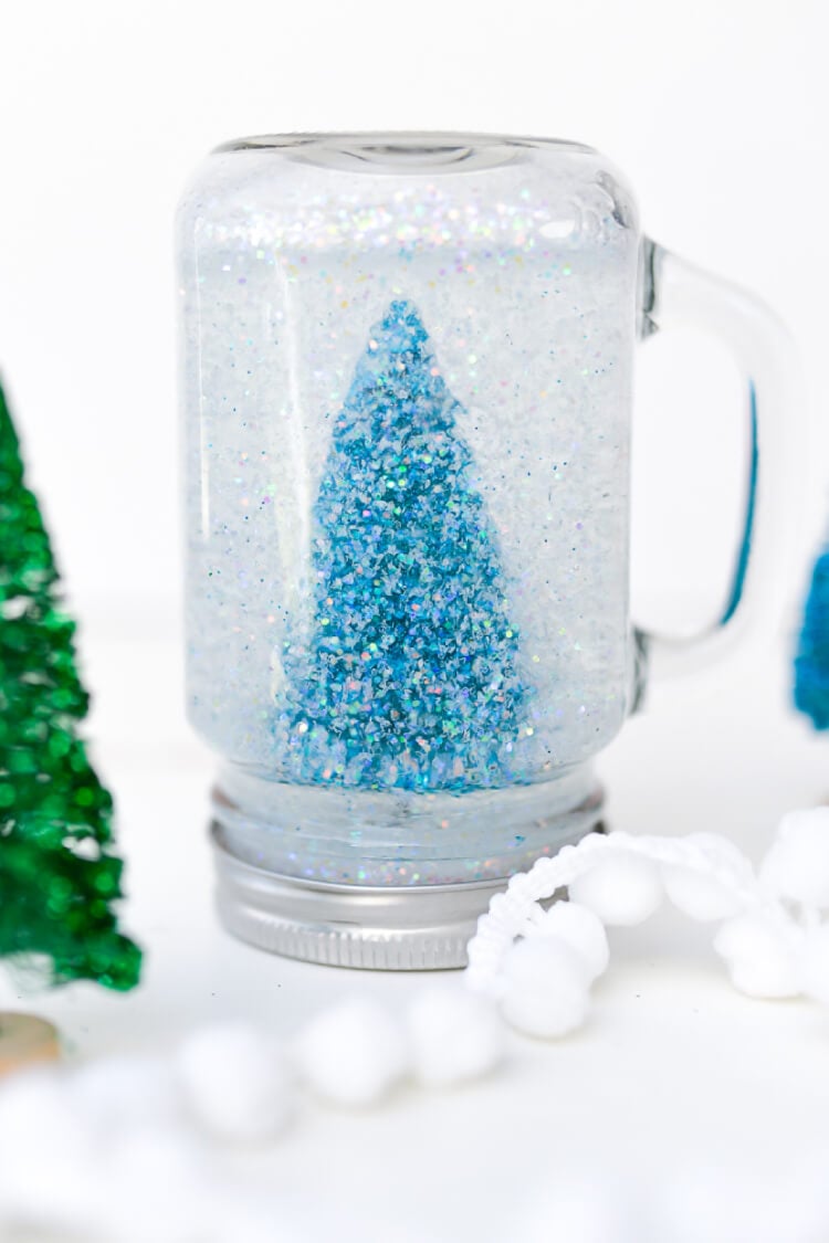 Christmas Photo Snow globe with glitter snowflakes and snow.
