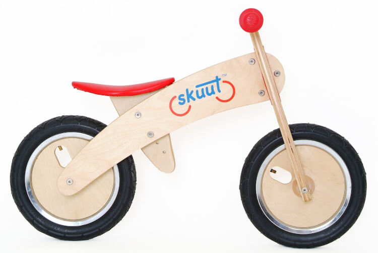 A Skuut Wooden Balance Bike