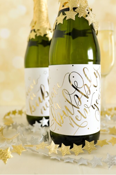A champagne bottle decked with these cute foiled labels is the perfect hostess gift to bring to a New Year's Eve party!