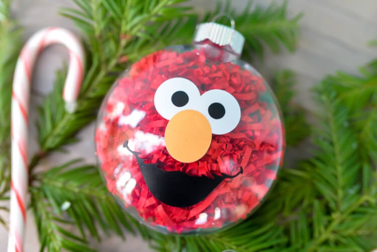 A close up of an ornament of Elmo