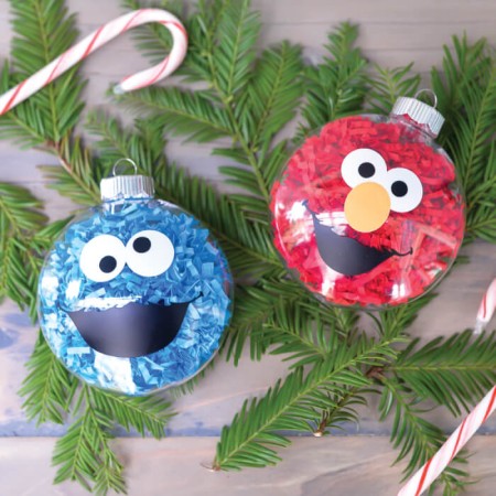 If your kids love Sesame Street, make these DIY Sesame Street Ornaments! They are a super easy Christmas craft and you'll love having Elmo and Cookie Monster on your Christmas Tree!