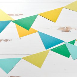 Colorful paper pennants hanging from a wall