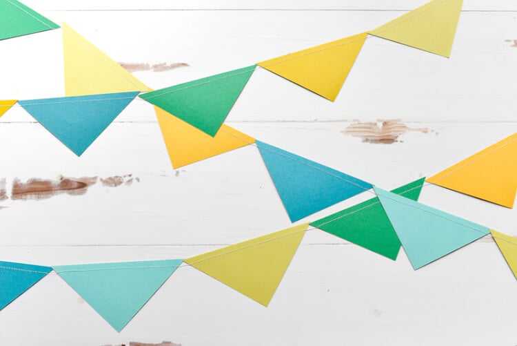 Colorful paper pennants hanging from a wall