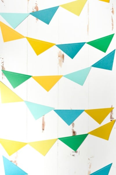 Colorful paper pennants hanging from a wall