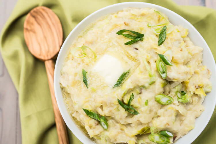 Colcannon is an Irish staple and is the perfect St. Patrick's Day side dish. Creamy buttery mashed potatoes plus leeks, garlic, and cabbage—you can't go wrong with this savory Irish dish!