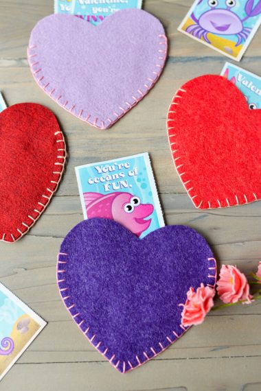 Hearts cut out of felt with Valentine cards stuck inside