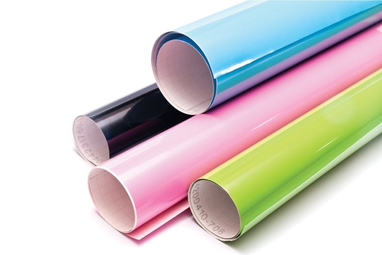 Pink, black, green and blue rolls of vinyl