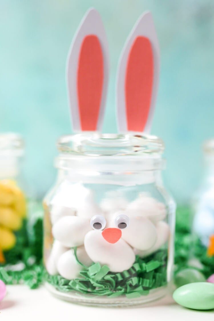 A close up of a jar decorated to resemble a rabbit