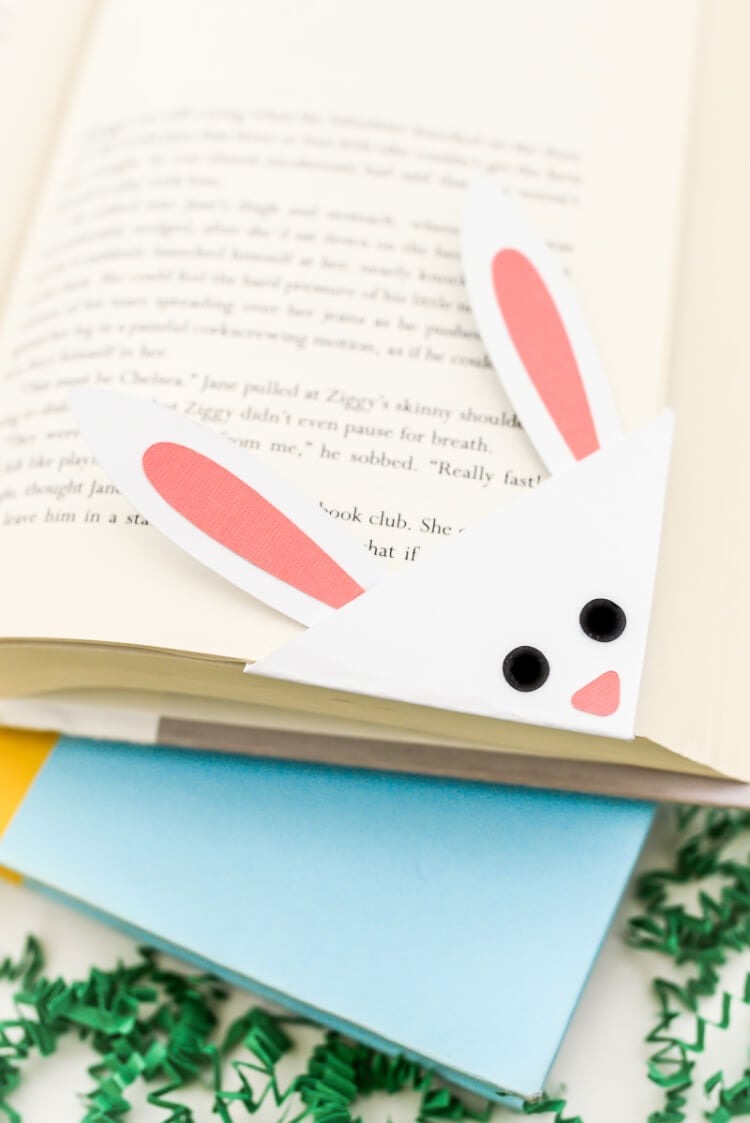 Close up of a bunny bookmark over the corner of a book