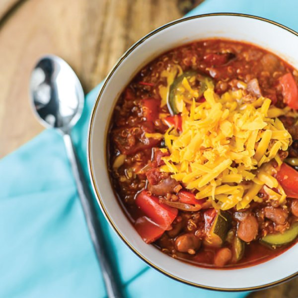 his simple but delicious vegetarian chili tastes like it simmered all day in your slow cooker, but it’s made quickly in the Instant Pot! Hearty quinoa and beans and plenty of vegetables means this dish can stand on its own for dinner. Leave off the cheese and it’s vegan! his simple but delicious vegetarian chili tastes like it simmered all day in your slow cooker, but it's made quickly in the Instant Pot! Hearty quinoa and beans and plenty of vegetables means this dish can stand on its own for dinner. Leave off the cheese and it's vegan!