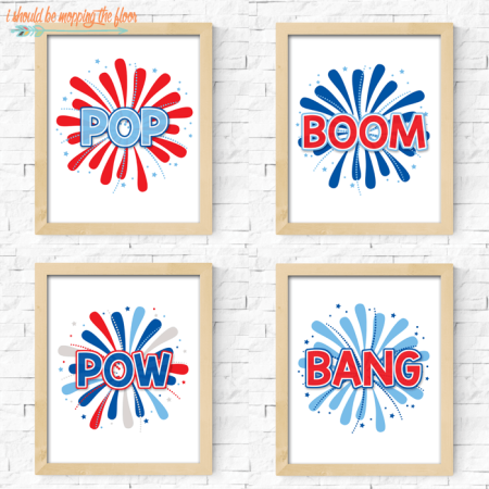 Four wooden framed pictures of fireworks and one says, "Pop" and one says, "Boom" and the third one says, "Pow" and the last one says, "Bang"