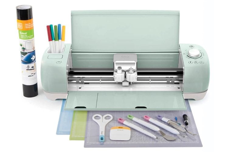 Image of Cricut machine, markers, mats and tools