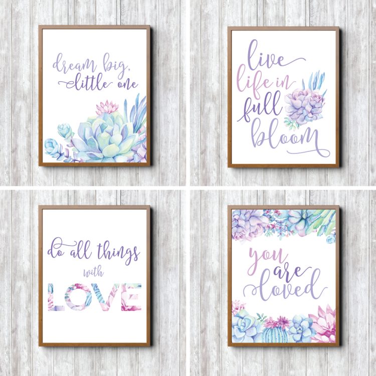 Four gold framed pictures hanging on a way with these sayings, \"Dream Big Little One\", \"Live Life in Full Bloom\", \"Do All Things with Love\" and \"You Are Loved\"