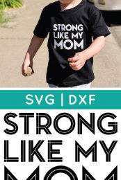 A little boy walking outside, wearing blue jean shorts and a black t-shirt that says, "Strong Like My Mom" with advertising by HEYLETSMAKESTUFF.COM for Stong Like My Mom t-shirt decals