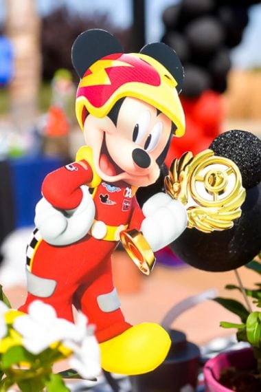 Picture of a Mickey Mouse toy holding a trophy