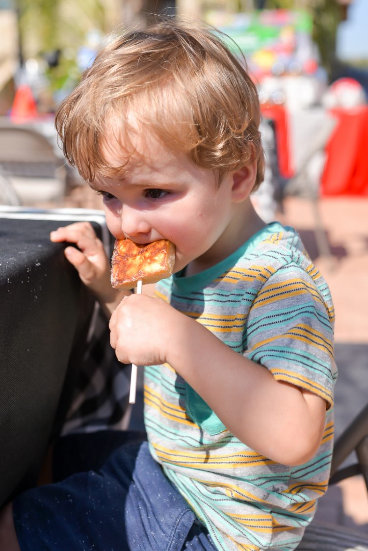 A little boy eating some food