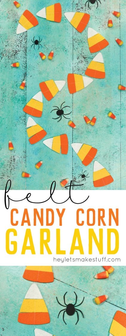 Real candy corn candy, paper cut black spiders and a candy corn garland lying on a aqua blue table and advertising for felt candy corn garland from HEYLETSMAKESTUFF.COM