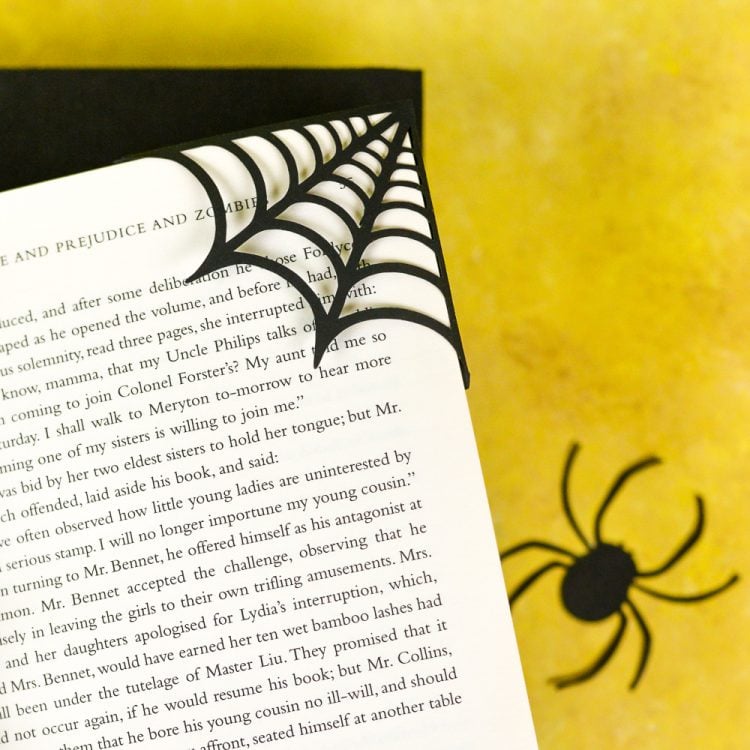 Make these clever corner Halloween bookmarks! The candy corn and spider web bookmarks are perfect for any time you're diving into a particularly spooky book. A FREE SVG and DXF download.