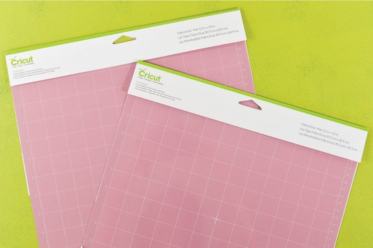 Two pink Cricut FabricGrip cutting mats