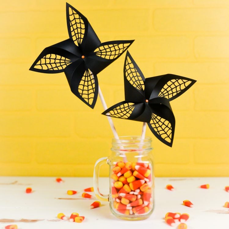 Get the SVG cut files for these Halloween spider web pinwheels! Delicate web cut-outs make these spooky pinwheels a hit at any Halloween party.