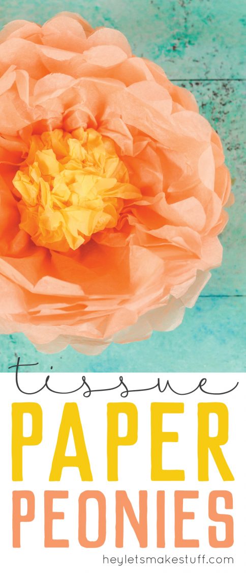 Close up of an orange and yellow paper tissue flower against an aqua background with advertising tissue paper peonies by HEYLETSMAKESTUFF.COM