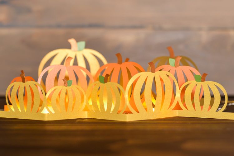 Paper cut pumpkin luminaria