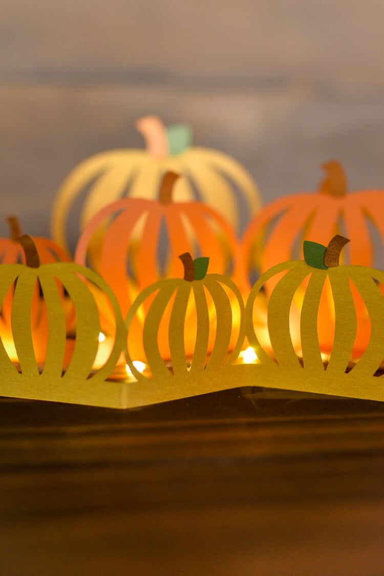 Paper cut pumpkin luminaria