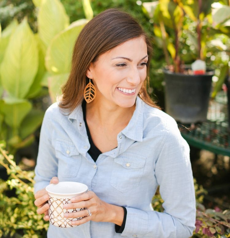 A woman holding a coffee cup