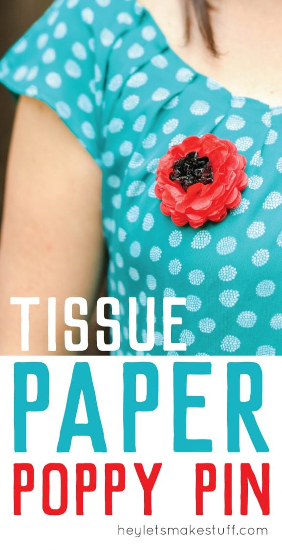 A close up of a woman in a blue polka dotted shirt with a paper poppy pinned to it with advertising of a tissue paper poppy pin from HEYLETSMAKESTUFF.COM