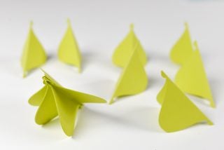 Pieces of paper ornament being assembled