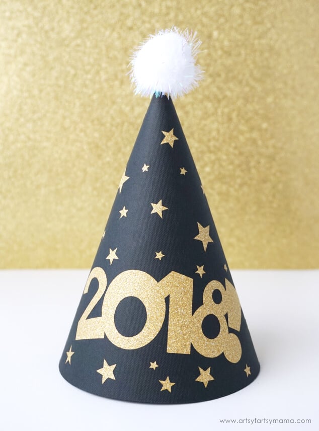 A party hat decorated with gold stars and the year 2018 on it